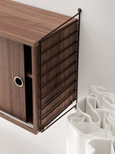 String Cabinet with Sliding Doors